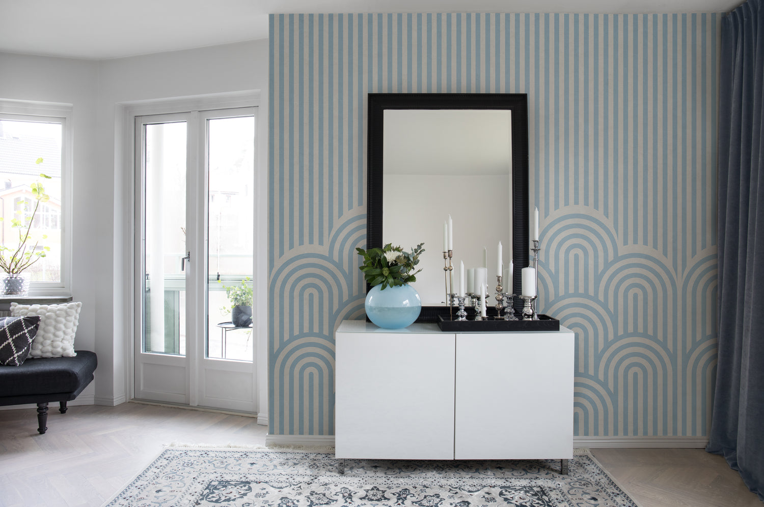 Soft blue geometric wallpaper with flowing arch patterns