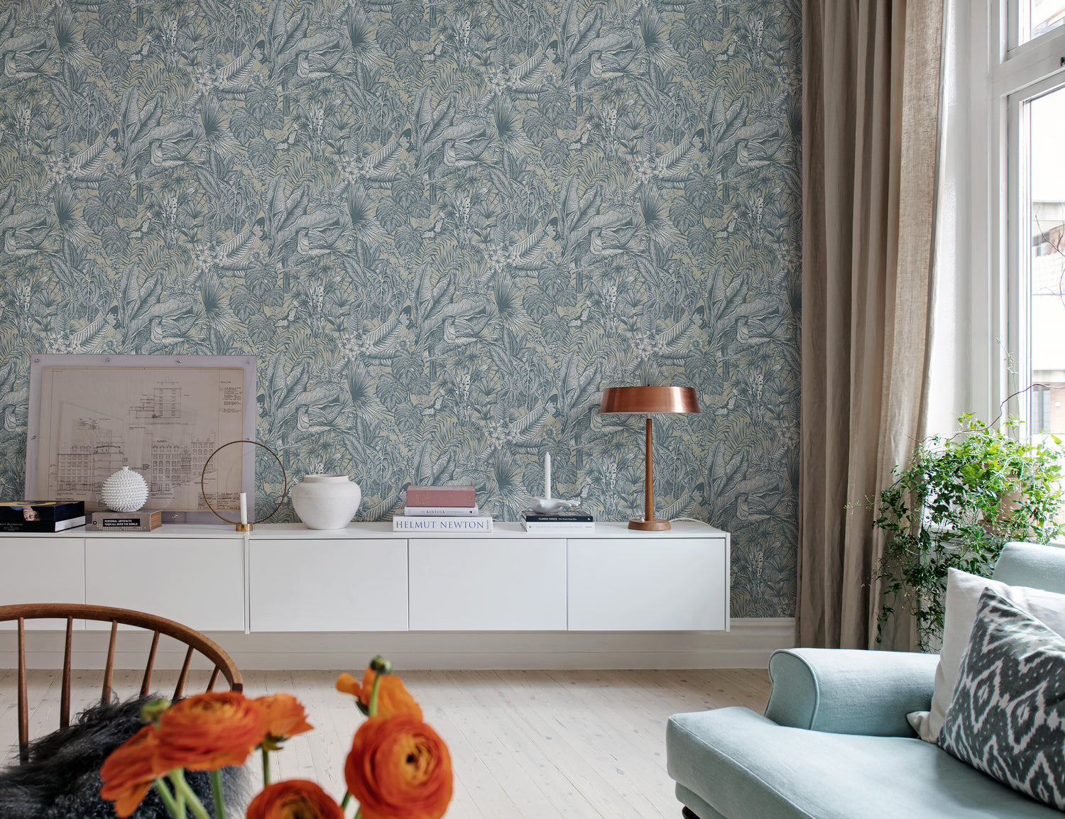 wallpaper with bird and flower design in dusty blue featured in living room