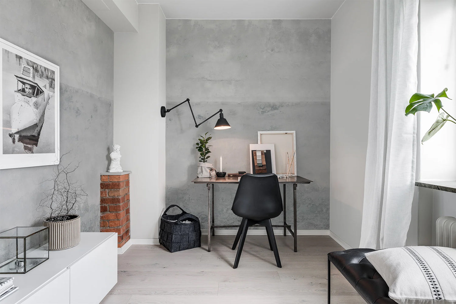 Plain grey wallpaper in bedroom with home office setting