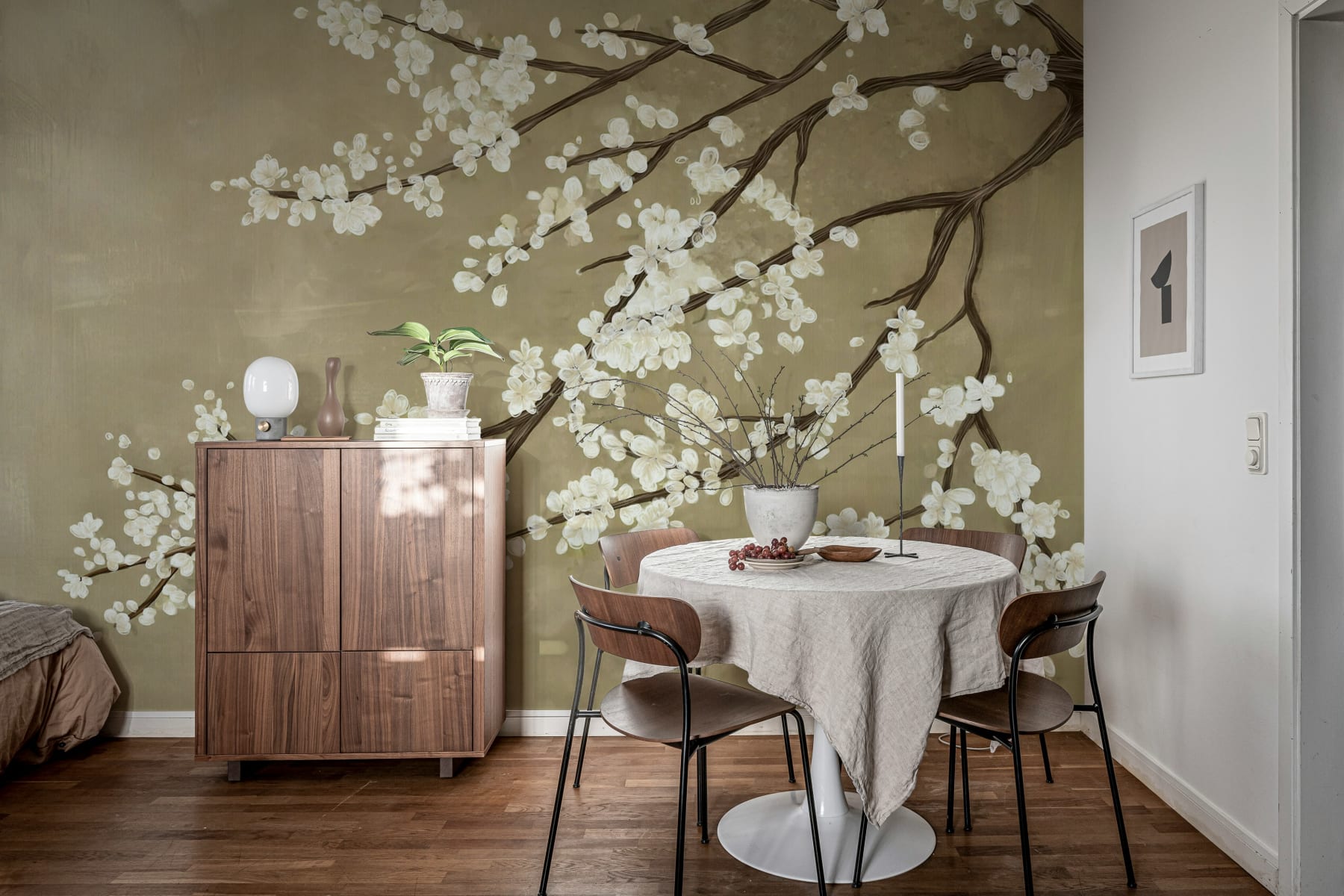 Sakura Branch, Beige Mural Wallpaper  featured in dining room, styled in walnut wood furniture and flooring.