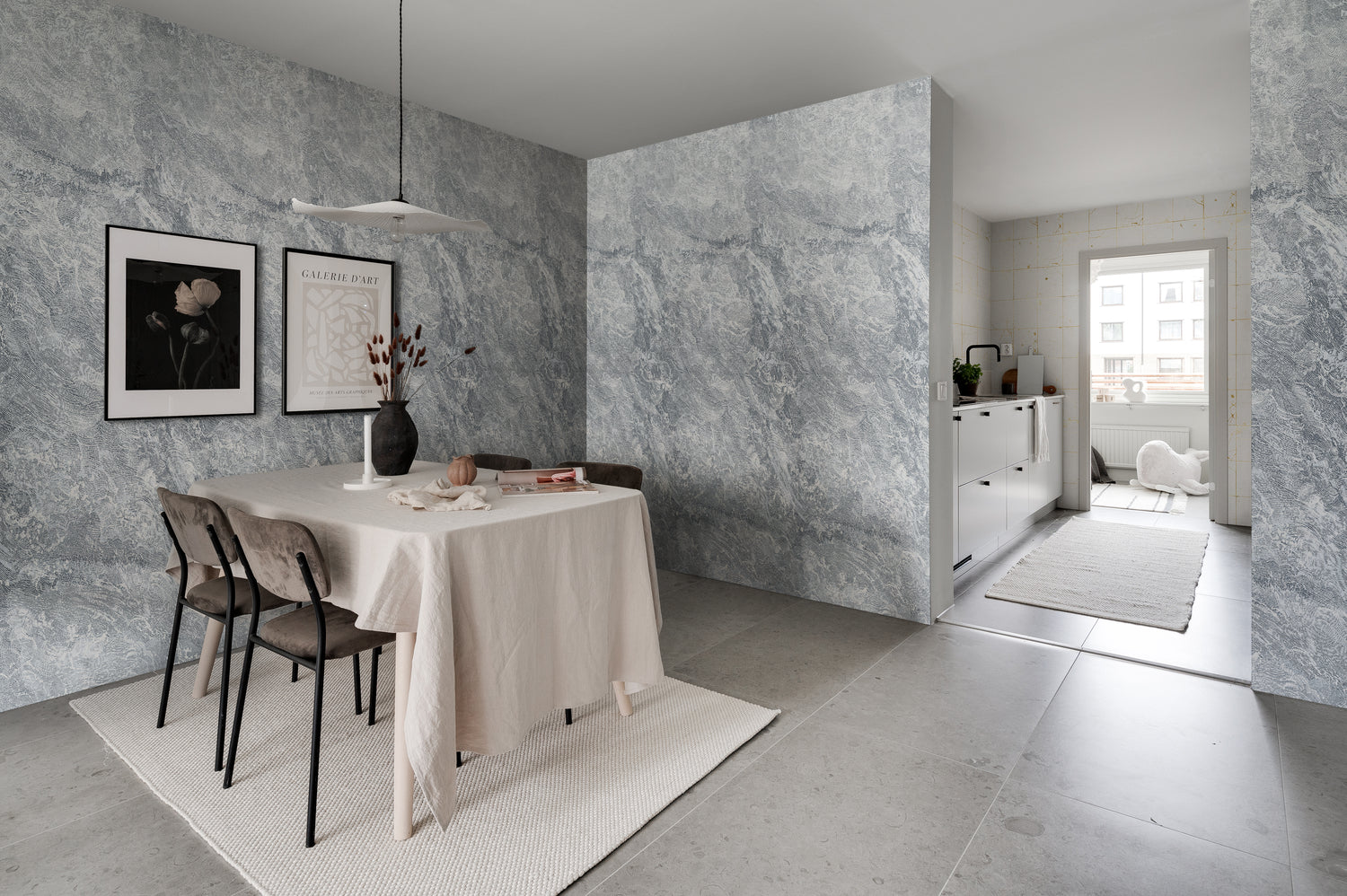 Breeze, Waves Mural Wallpaper in soft grey tones creating a calm monochrome feature wall in a modern living room.