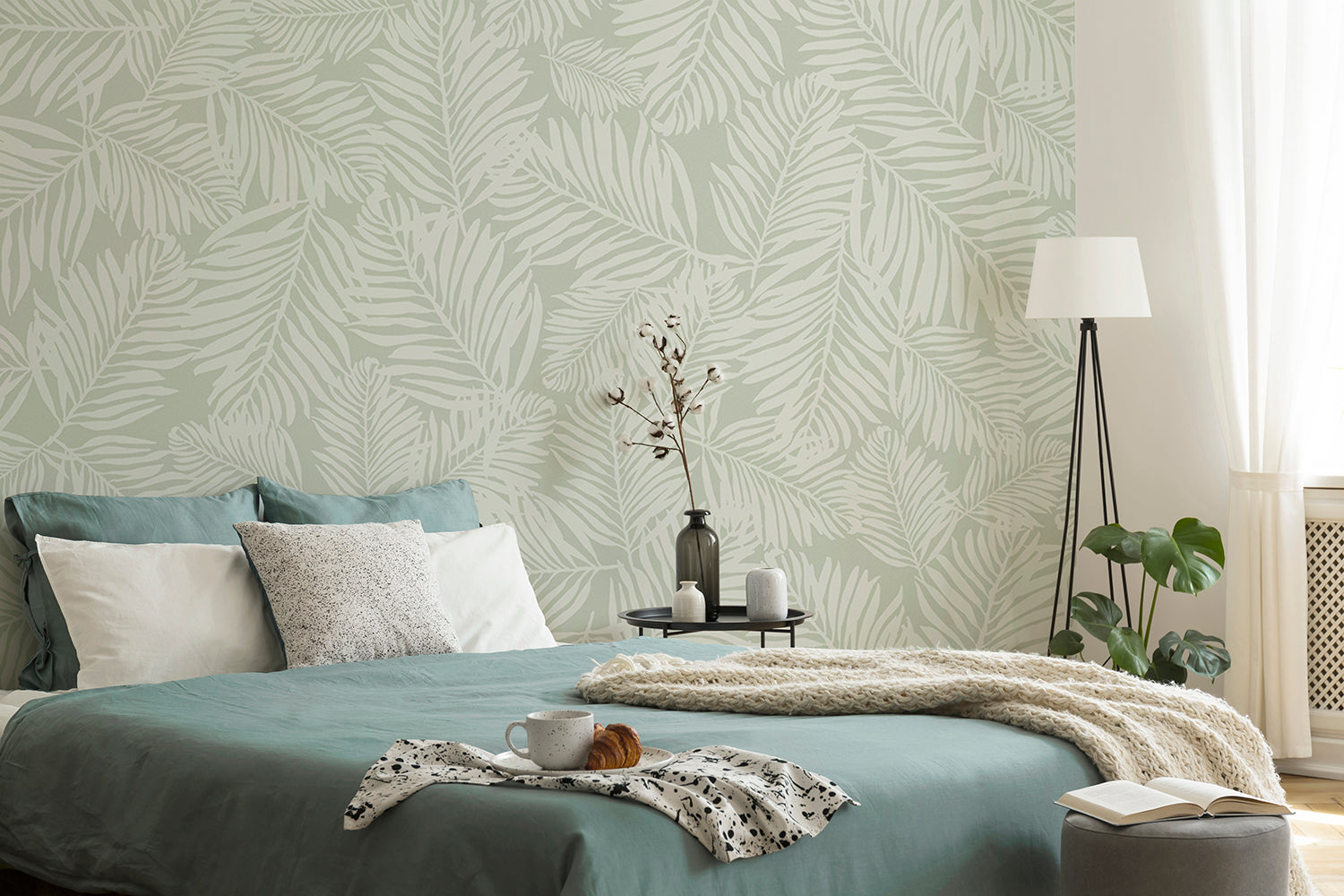 Simple green wallpaper with fern pattern creating soft natural interior
