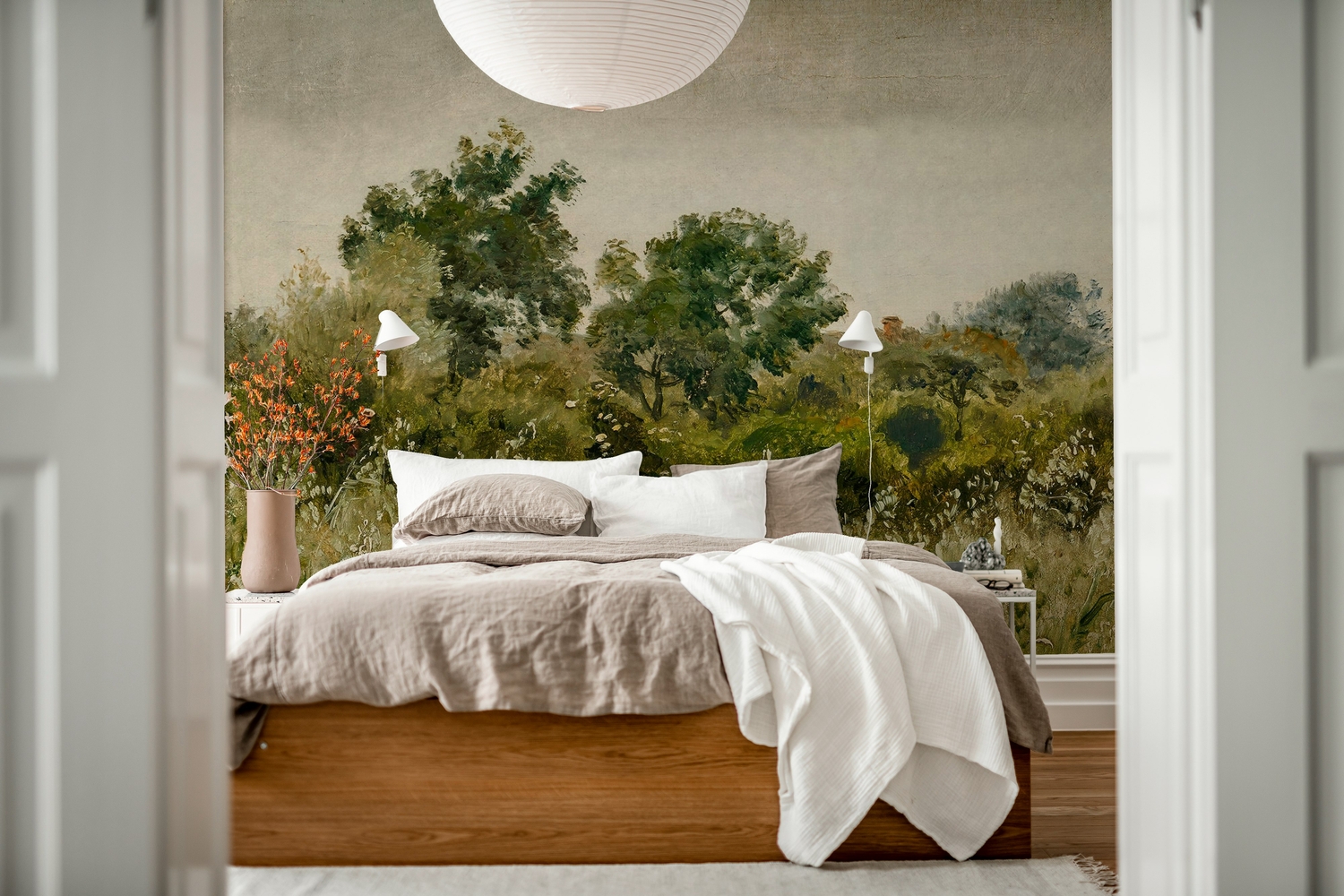 bedroom feature wall with oatfields landscape mural wallpaper behind a cosy bed