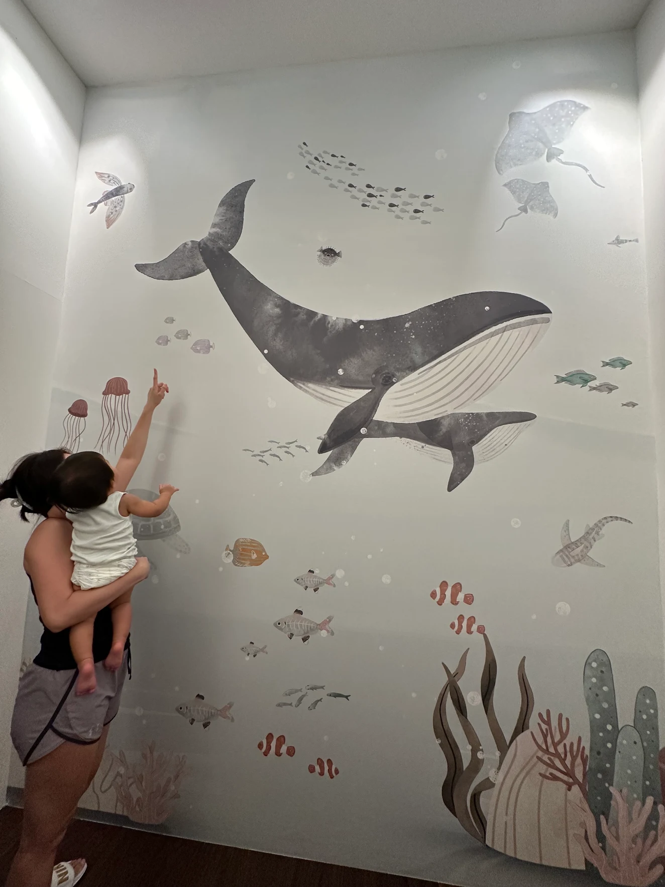 Ocean and friends Wallpaper in a kids room filled with fishes, whales, stringray and coral